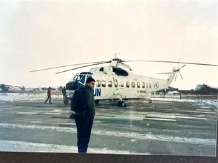 Jean-Selim in front of helicopter